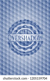 Overshadow blue emblem with geometric pattern background.