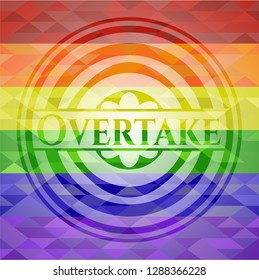 Overtake emblem on mosaic background with the colors of the LGBT flag