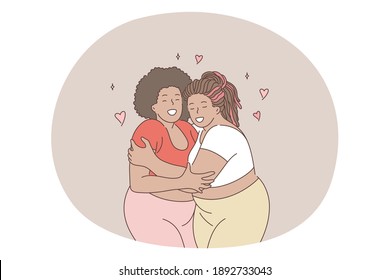 Overweight, obesity, plus size women concept. Young smiling black women friends in comfortable casual clothing standing hugging each other and enjoying spending time together living active happy life 