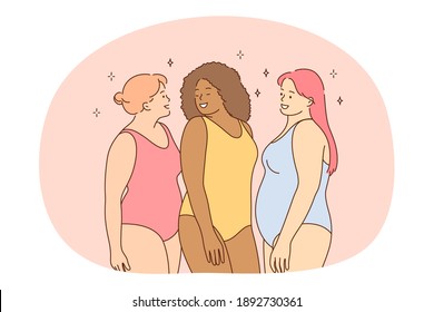 Overweight, plus size, obesity concept. Young smiling women friends of different ethnicities in colourful swimsuits standing and enjoying vacations together living active happy life 