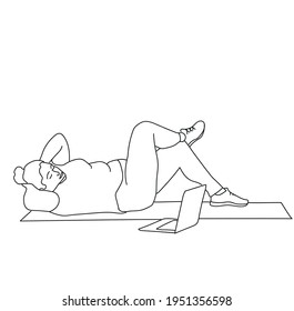 Overweight woman doing exercise while watching tutorial on laptop at home
