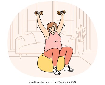 Overweight woman doing sports, wanting to lose weight, lifts dumbbells sitting on inflatable fitness ball. Girl is trying to get rid of excess weight with help of fit training and physical exercises.