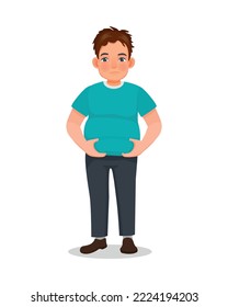 overweight young man touching his fat belly hoping to lose body weight