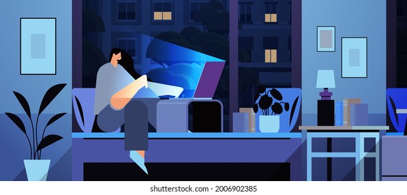 overworked businesswoman freelancer looking at computer screen girl sitting on bed in dark night home room