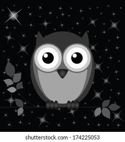 Owl against a starry black night sky