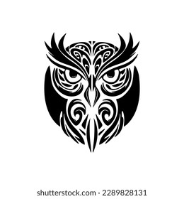 Tattoo of an owl in black and white, adorned with Polynesian designs.