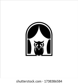 owl in the black window