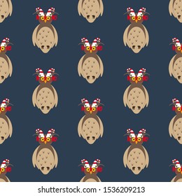 Owl in christmas costume seamless pattern on the blue background. Vector illustration