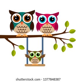 Owl family on a branch