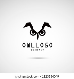 Owl geometric flat logo. Logotype of an owl with angry eyes.