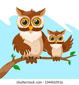 Owl and her baby owls sitting on a branch.