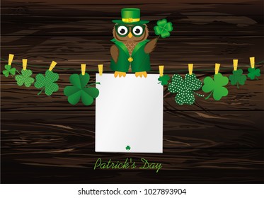 Owl in the national costume for the day Patrick is sitting on a rope hanging from the Petals of clover with a paper blank with clothespins.Vector illustration. Greeting card with empty space for text