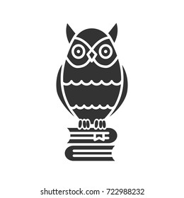 Owl on books stack glyph icon. Silhouette symbol. Emblem of wisdom and knowledge. Negative space. Vector isolated illustration