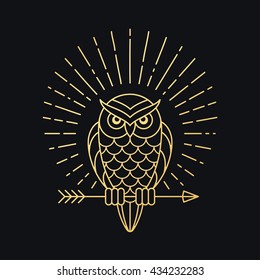 Owl outline emblem in geometric hipster style with arrow and beams. Golden symbol on black background. Vector illustration.