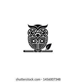 owl silhouette perched on a tree branch