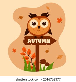Сute owl sitting on the sign with the inscription autumn. Autumn leaves, mushrooms, grass and a branch of leaves around. 