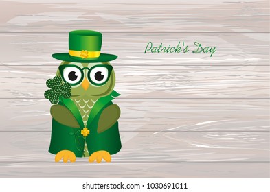 Owl in traditional green suit and glasses on the day of Patrick. Greeting card with owlet. Free space for your ad or text. Vector illustration on wooden background.