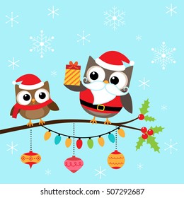 Owls in costumes sitting on branch. Christmas card