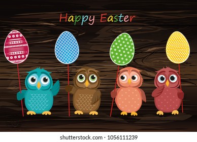 Owls keep Easter decorated eggs on a stick. Multicolored. Vector on wooden background. Greeting card for the holiday. Empty space for text.
