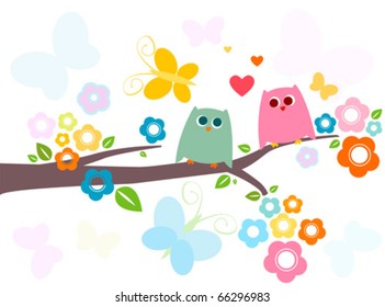 owls in love on a flowery tree branch