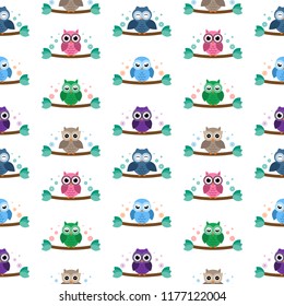 Owls on the brunches seamless pattern 