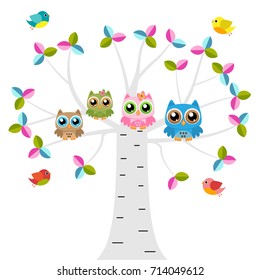 Owls on a tree with birds