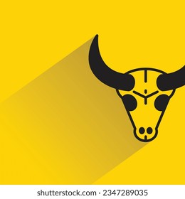 ox head with shadow on yellow background