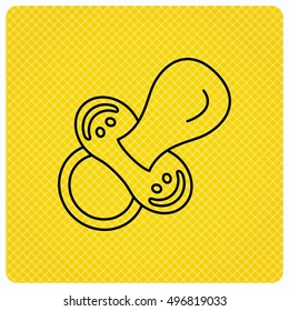 Pacifier icon. Nipple or dummy sign. Newborn child relax equipment symbol. Linear icon on orange background. Vector