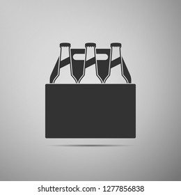 Pack of beer bottles icon isolated on grey background. Case crate beer box sign. Flat design. Vector Illustration