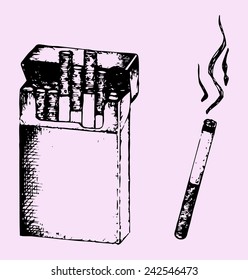 Pack of the cigarettes and lit cigarette with smoke isolated on pink background