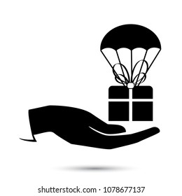Package flying down with parachute, black icon, concept for delivery service. Vector illustration