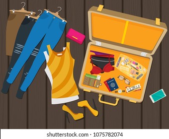 Packed suitcase for summer holiday - vector illustration