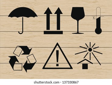 Packing symbols set on wooden background. Vector illustration