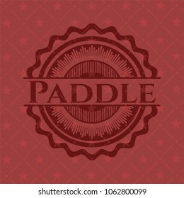 Paddle badge with red background