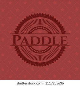 Paddle badge with red background