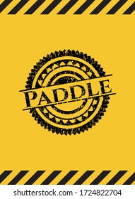 Paddle black grunge emblem with yellow background. Vector Illustration. Detailed. 