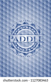 Paddle blue badge with geometric pattern.