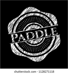 Paddle chalkboard emblem on black board