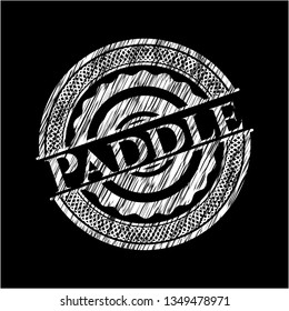 Paddle chalkboard emblem on black board