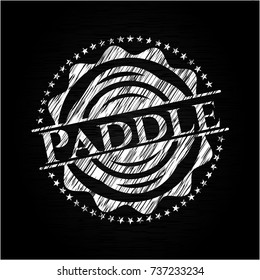 Paddle chalkboard emblem on black board