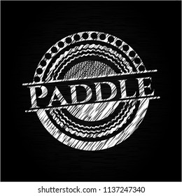 Paddle chalkboard emblem written on a blackboard