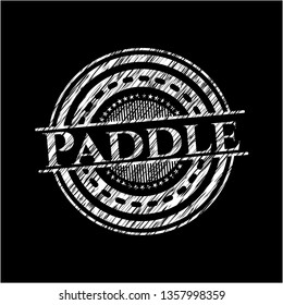 Paddle chalkboard emblem written on a blackboard
