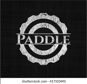 Paddle on chalkboard