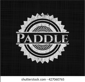 Paddle on chalkboard