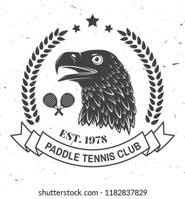 Paddle tennis badge, emblem or sign. Vector illustration. Concept for shirt, print, stamp or tee. Vintage typography design with paddle tennis racket and eagle silhouette.