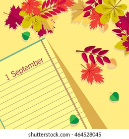 Page Notepad with pencil on background of autumn leaves. Back to school.