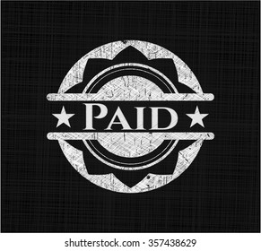 Paid chalkboard emblem written on a blackboard