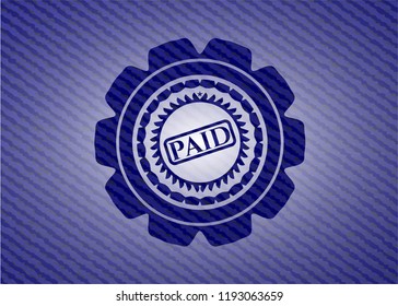 paid icon inside denim background