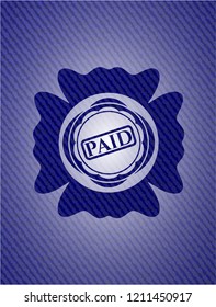paid icon inside denim background