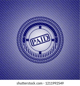 paid icon inside denim background